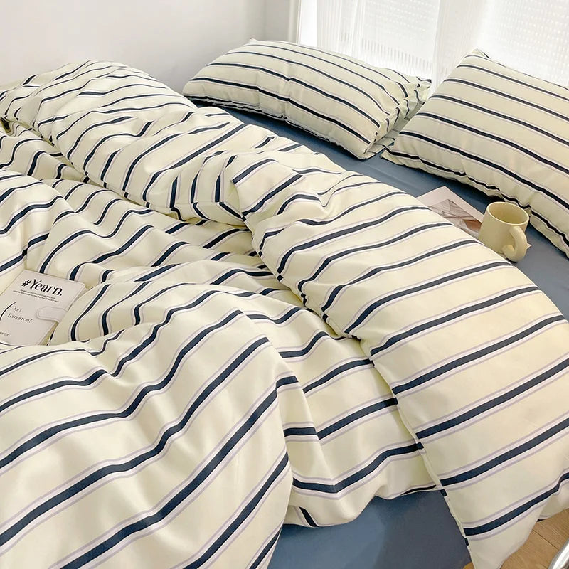 Simple Red and Blue Striped Duvet Cover and Four Piece Bed Sheet Set with Washed Cotton Bedding on the Bed
