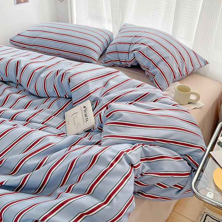Simple Red and Blue Striped Duvet Cover and Four Piece Bed Sheet Set with Washed Cotton Bedding on the Bed